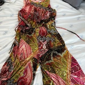 Sleeveless jumpsuit with asymmetrical bottom